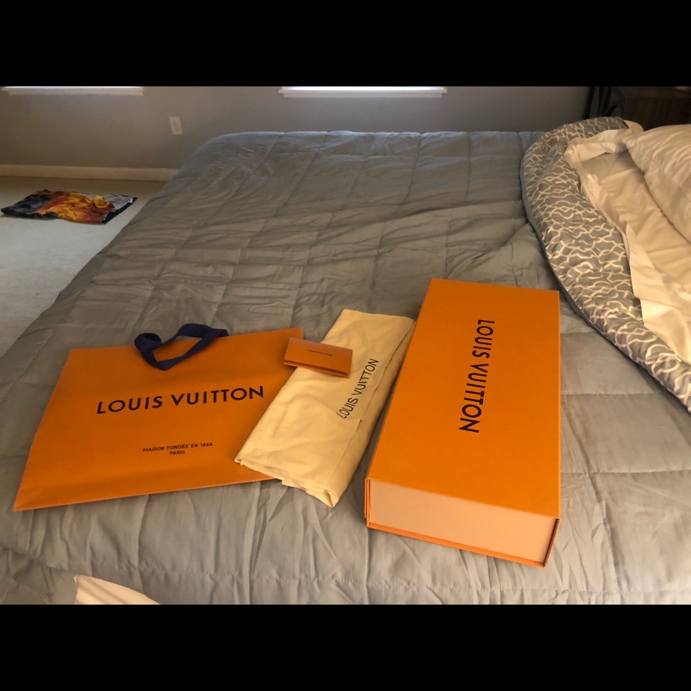 XL Louis Vuitton gift bag, gift box, and duster